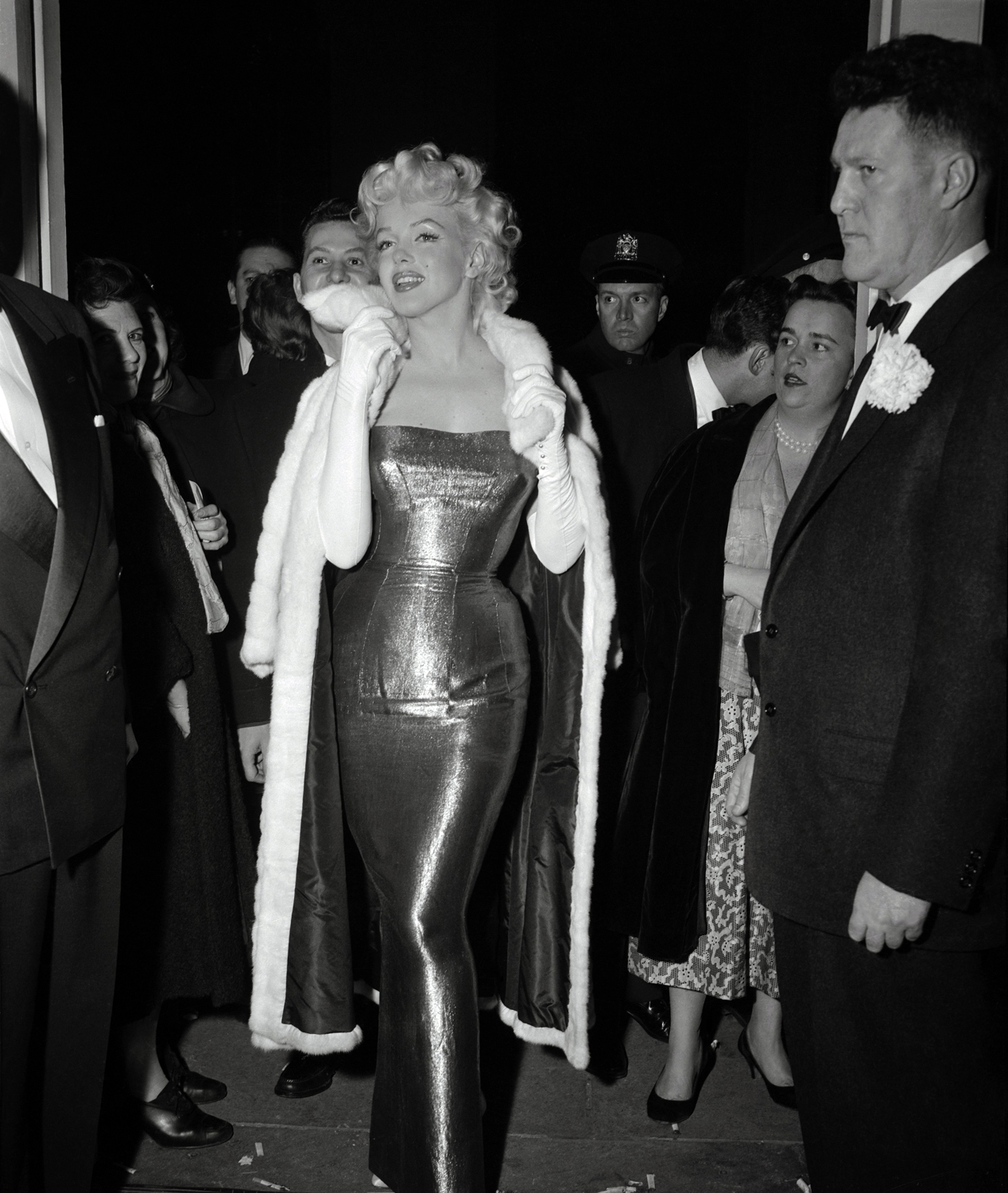 Monroe steals the show again as she arrives wearing a slinky evening gown for the New York opening of Tennessee William's New Play, Cat On A Hot Tin Roof in March, 1955.
