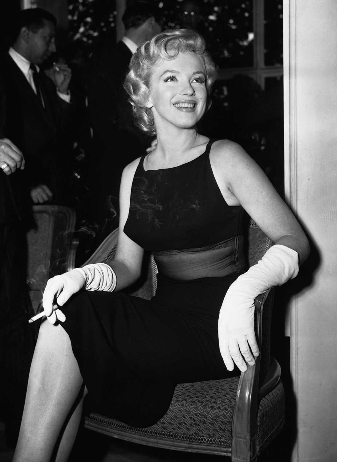 Monroe smiles during a press conference at the Savoy Hotel in London in July 1956.