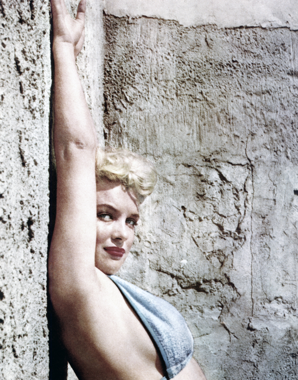 Monroe poses in a bikini top circa 1955.