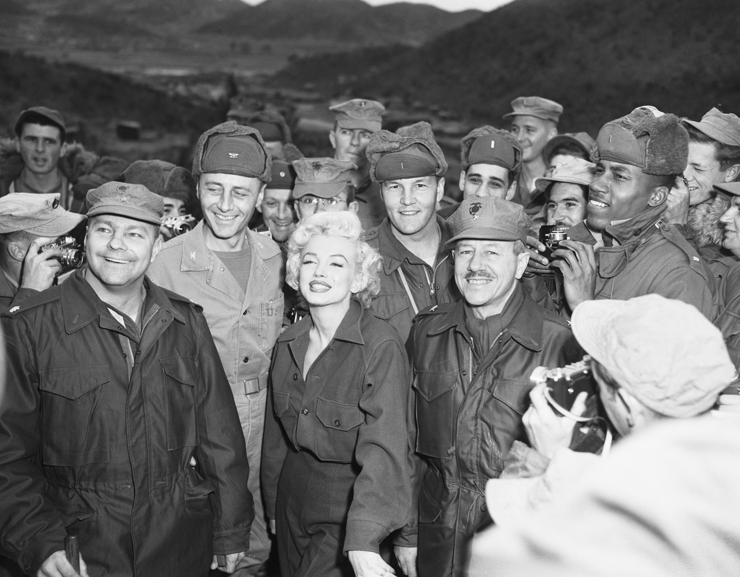 The star posing with troops in South Korea in 1954.