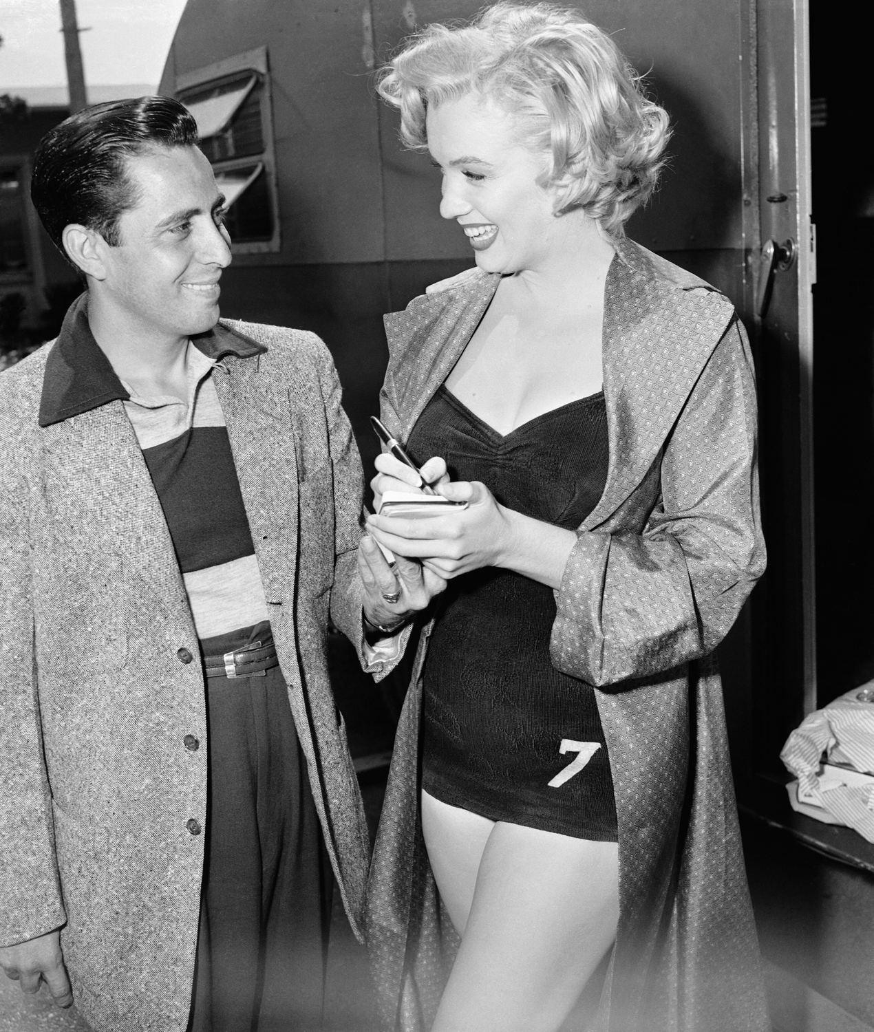Marilyn Monroe Standing by Young Man