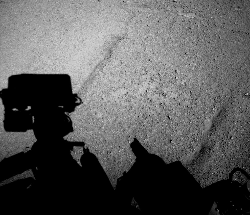 NASA's Curiosity Mars rover captures its own shadow in this image taken just after it completed a drive of 329 feet (100.3 meters) on the 547th Martian day, or sol, of its work on Mars (Feb. 18, 2014).