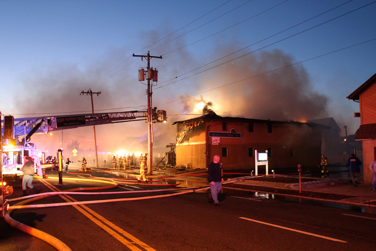Firefighters work to put out a fire at Mariner's Cove Inn in Point Pleasant Beach, N.J., March 21, 2014.