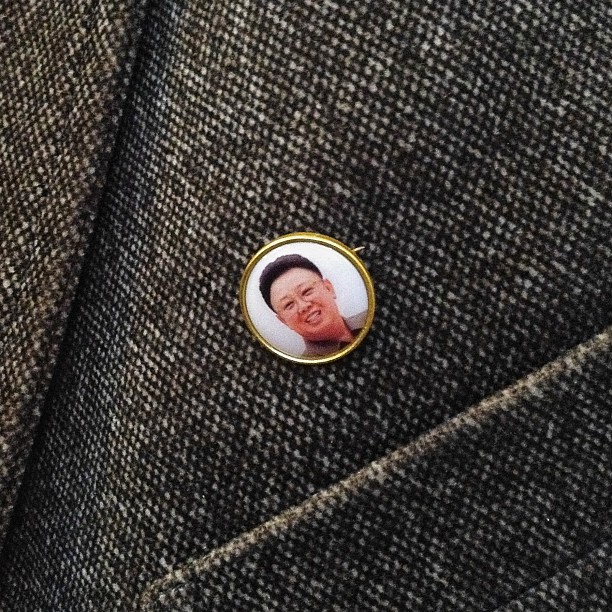 A pin over the heart of every North Korean citizen, July 25, 2013.