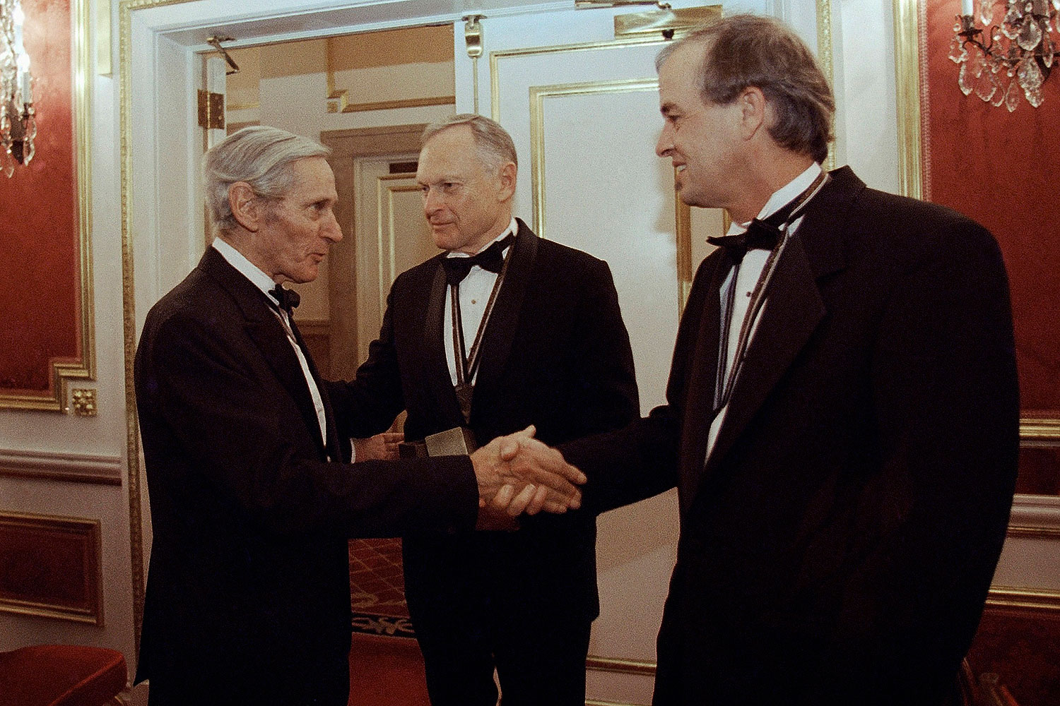 In this Nov. 16, 1994, file photo, The National Book Awards prize winning writers Sherwin B. Nuland, center, William Gaddis, left, and James Tate greet each other after the awards ceremony in New York. Nuland, has died at age 83 (Adam Nadel / AP)
