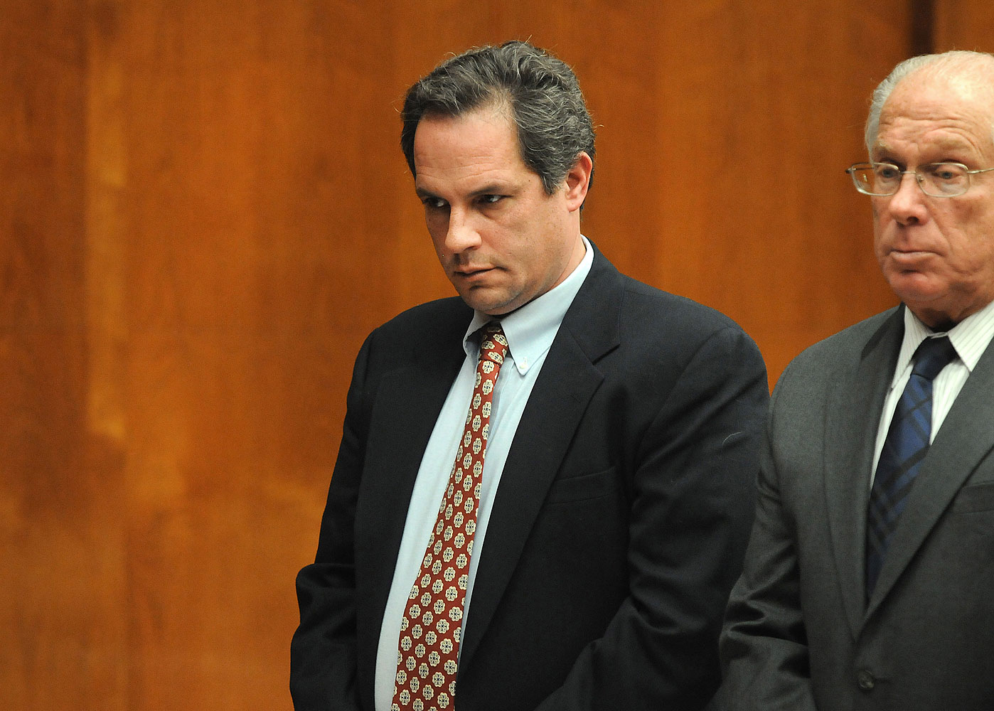 Thomas Rica, a former Ridgewood borough employee, stands with his attorney Robert Galantucci, during a hearing at the Bergen County Courthouse Wednesday, March 19, 2014, in Hackensack, N.J.