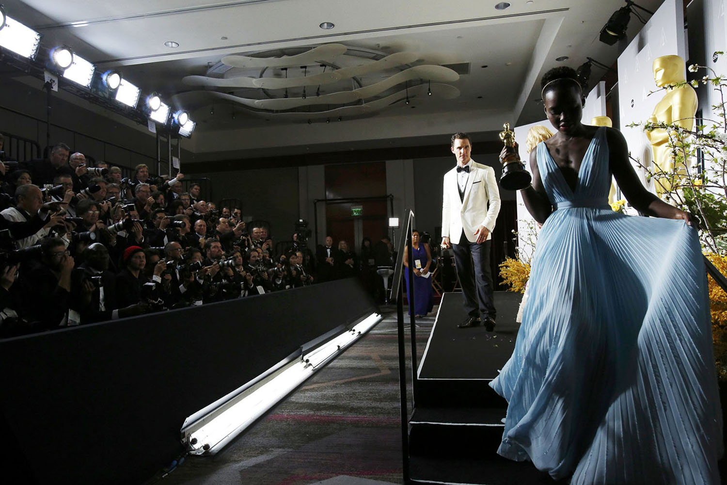 Mar. 2, 2014. Lupita Nyong'o and Matthew McConaughey walk offstage after posing with their awards for best supporting actress for  12 Years a Slave  and best actor for his role in  Dallas Buyers Club  at the 86th Academy Awards in Hollywood, California.