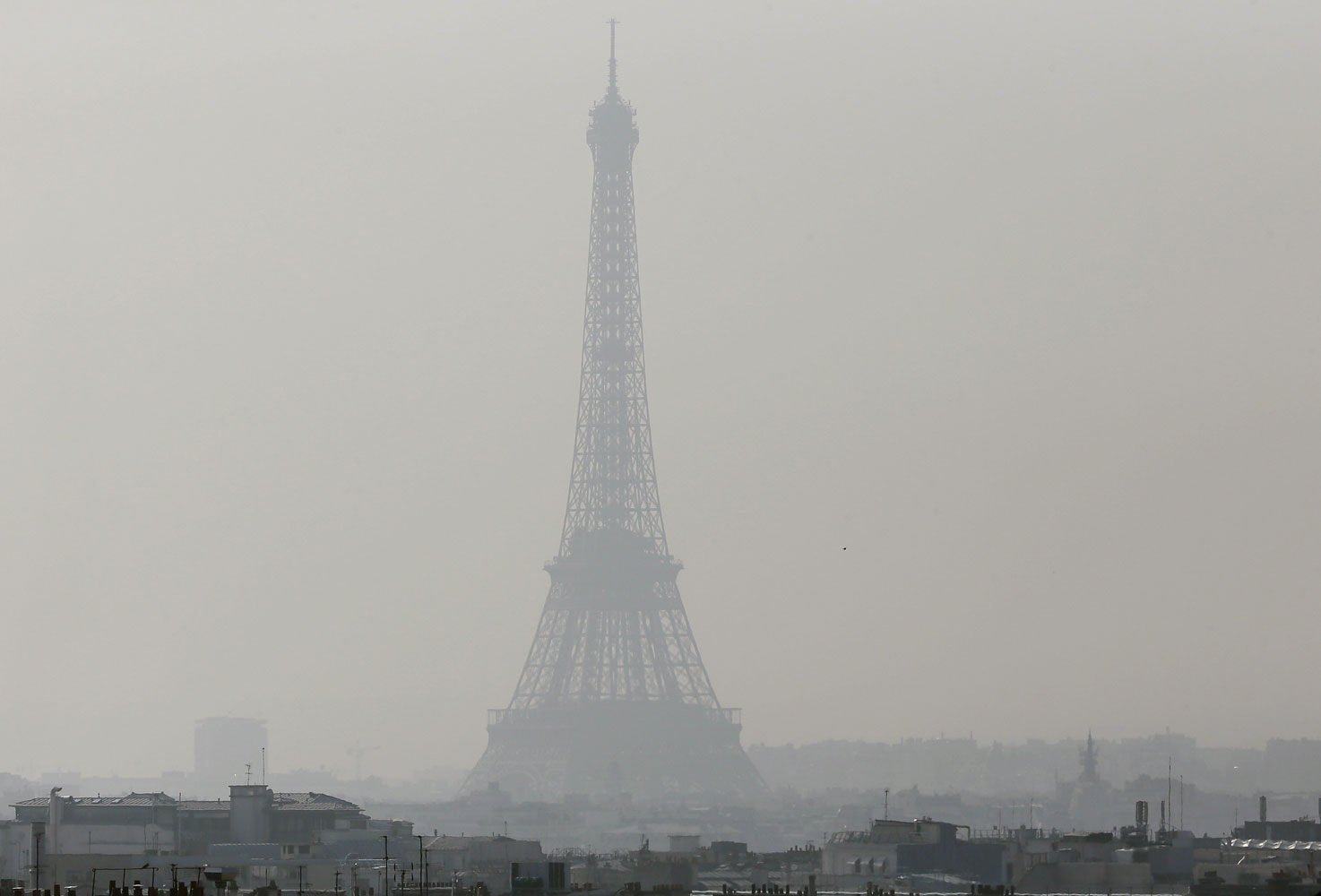 A view of the Eiffel Tower seen through thick smog, on March 14, 2014, in Paris. (Patrick Kovarik—AFP/Getty Images)