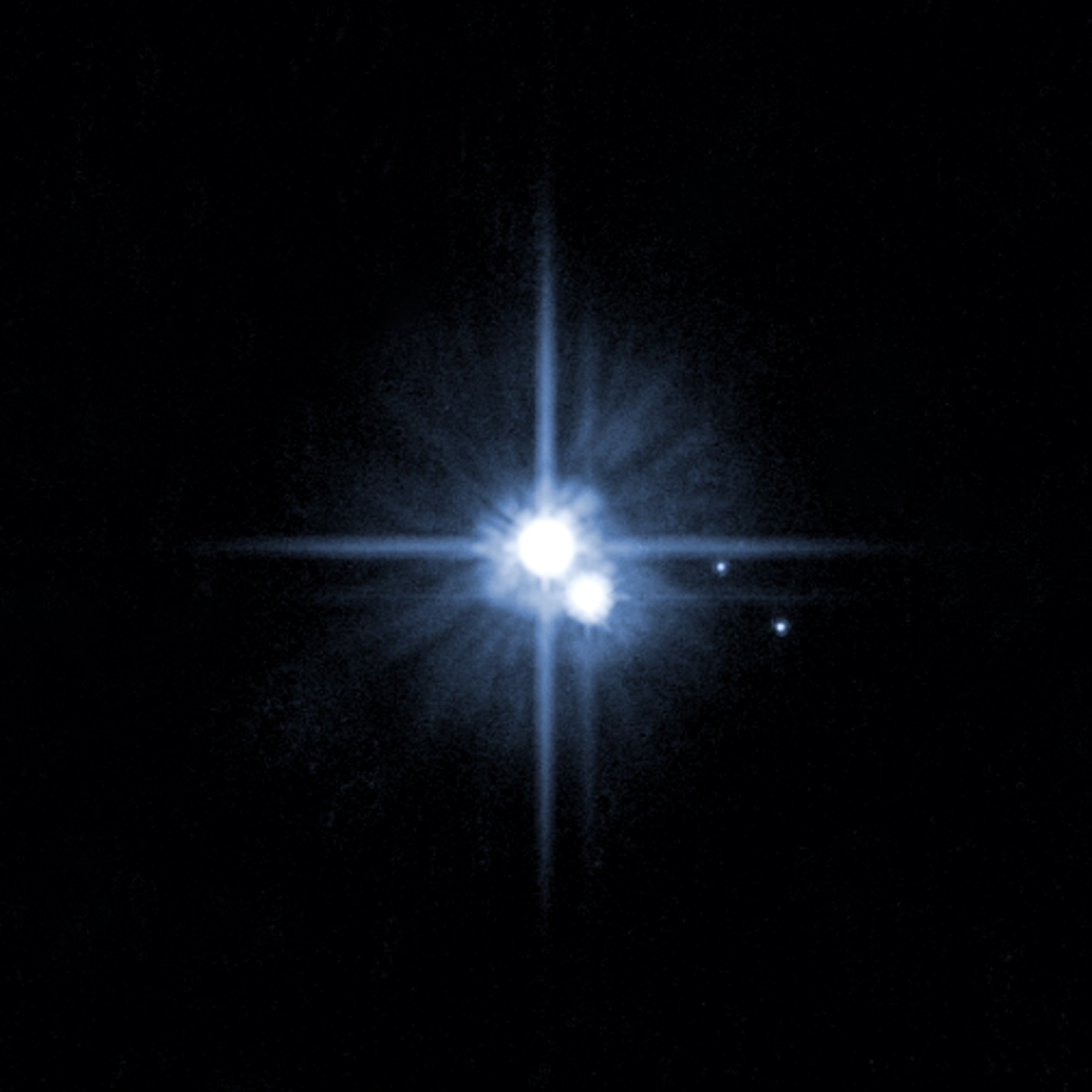 A pair of small moons orbiting pluto discovered by NASA's Hubble Space Telescope.
