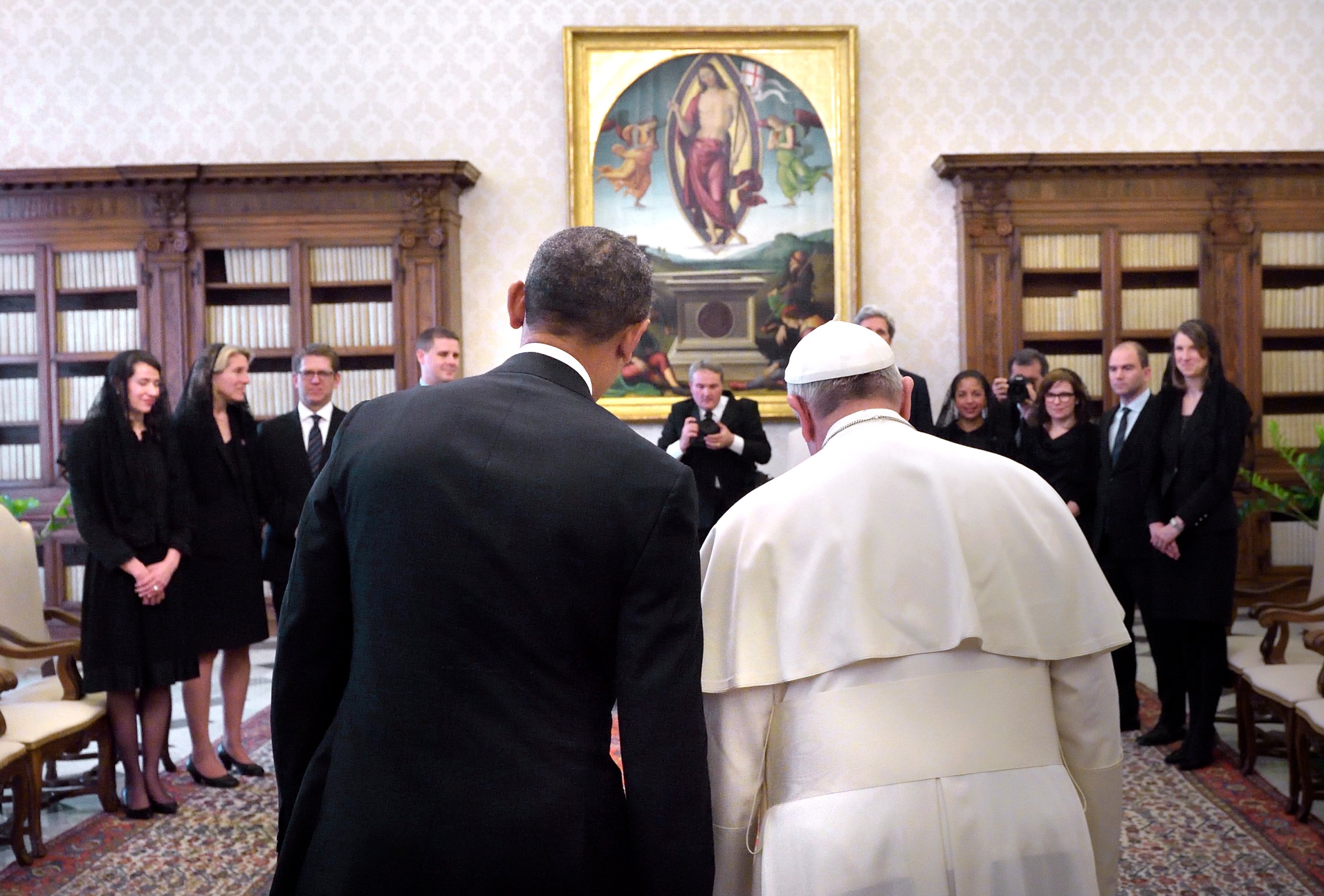 U.S. President Barack Obama speaks with Pope Francis during their meeting at the Vatican March 27, 2014.