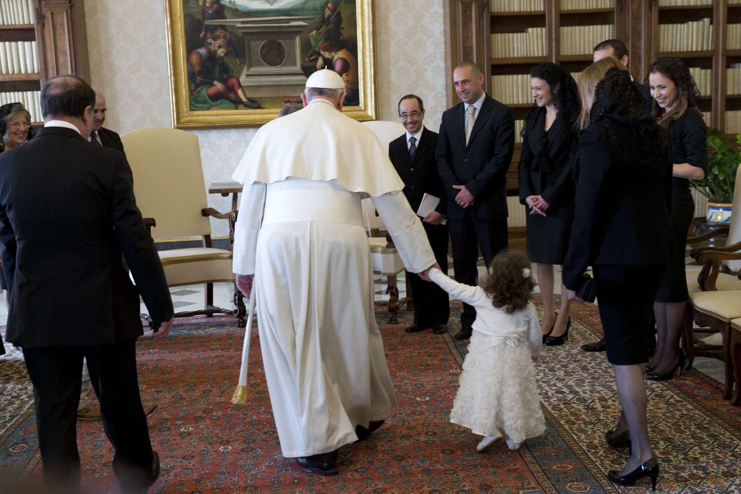 Mar. 21, 2014. Pope Francis holds Giorgia May, the granddaughter of Malta's President George Abela (L), by the hand during a private audience in the Pontiff's studio at the Vatican.