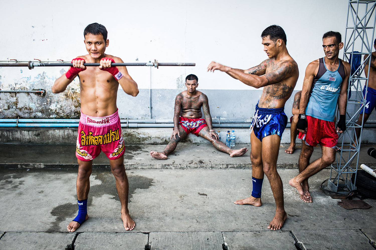 Moo, 23, builds muscle for Muay Thai on the Klong Prem prison yard, in Bangkok, Nov. 2013. (Aaron Joel Santos)