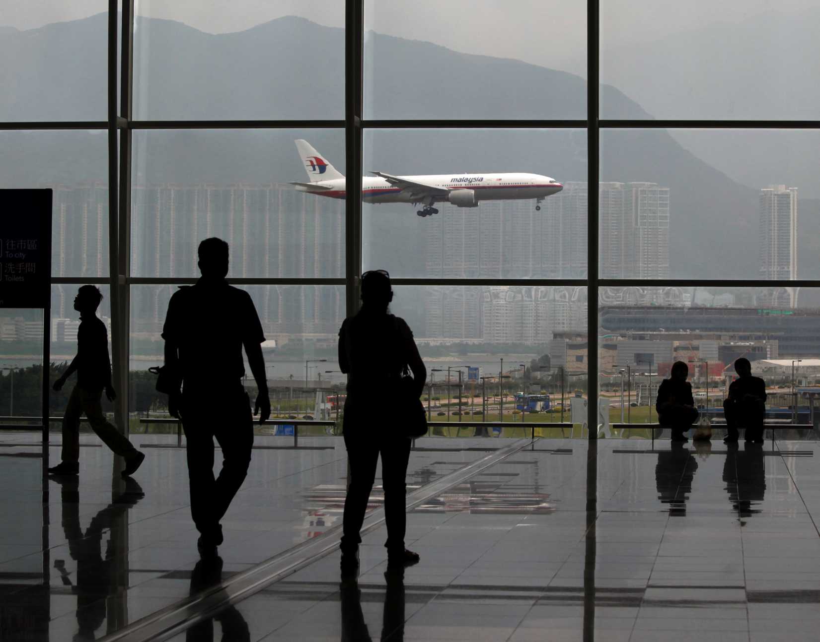 A Malaysia Airlines Boeing 777 plane is seen from the departure hall at the Hong Kong International Airport in a file photo taken in June 2011