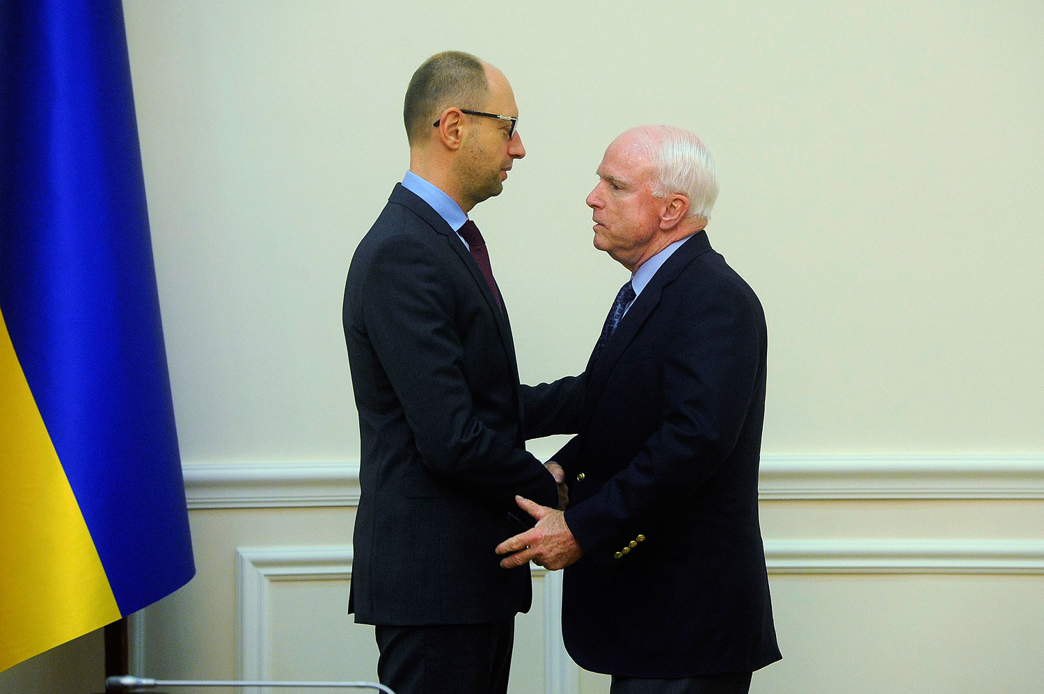 Ukraine's Prime Minister Arseny Yatseniuk, left, meets with Senator John McCain in Kiev March 15, 2014. (Andrew Kravchenko/Pool—Reuters)
