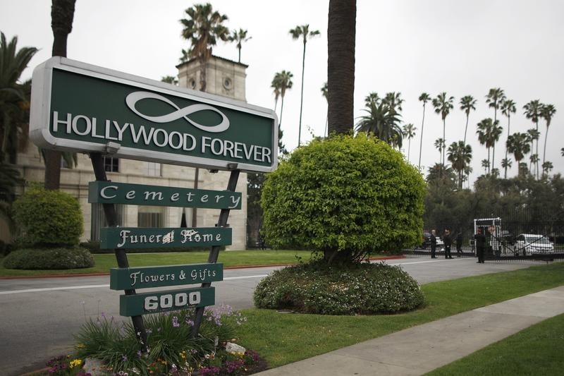 The front gate to the Hollywood Forever cemetery, where a memorial service for fashion designer L'Wren Scott, was held, is seen in Los Angeles