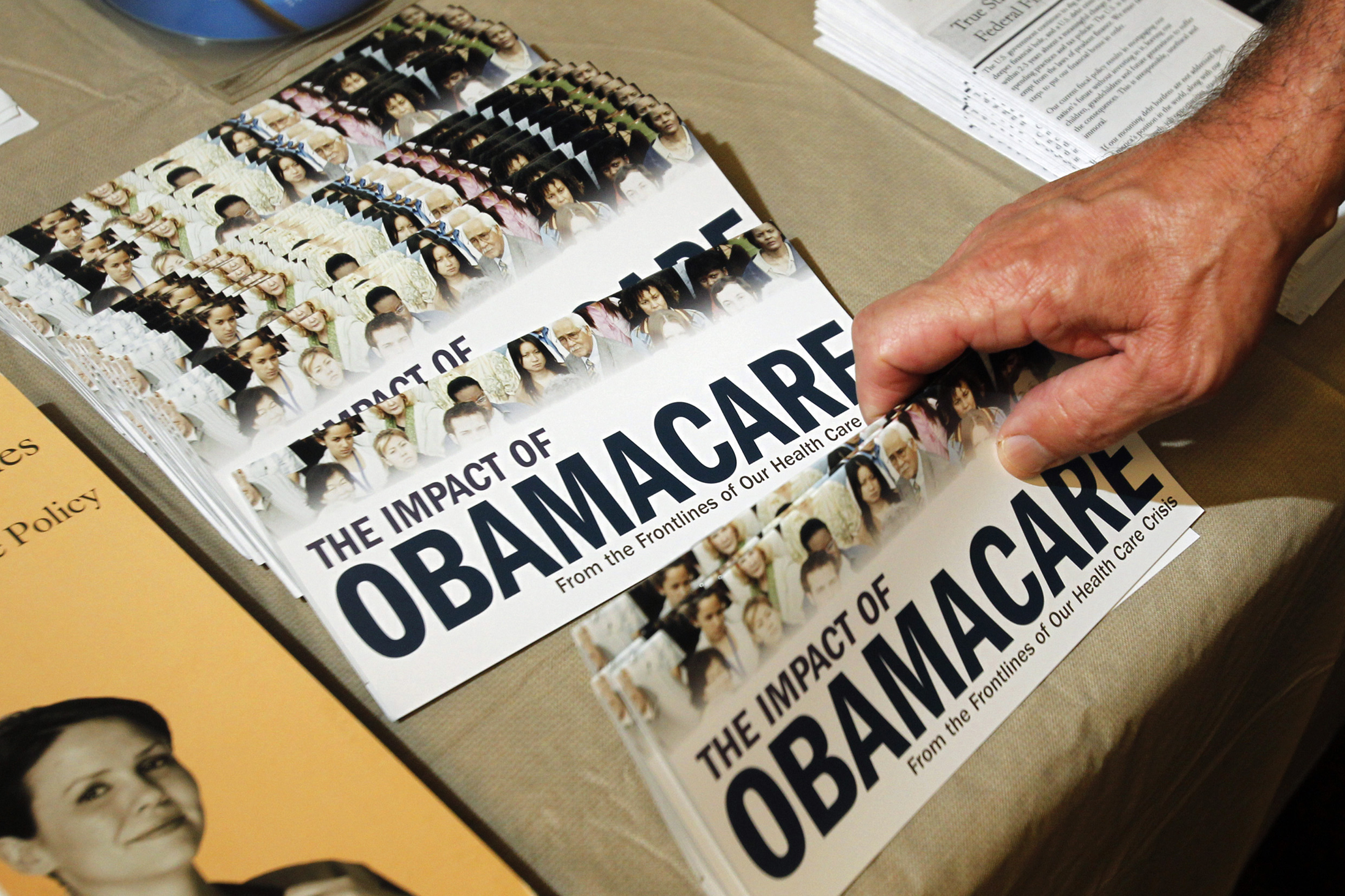 File photo of an Obamacare pamphlet at a Tea Party rally in Littleton