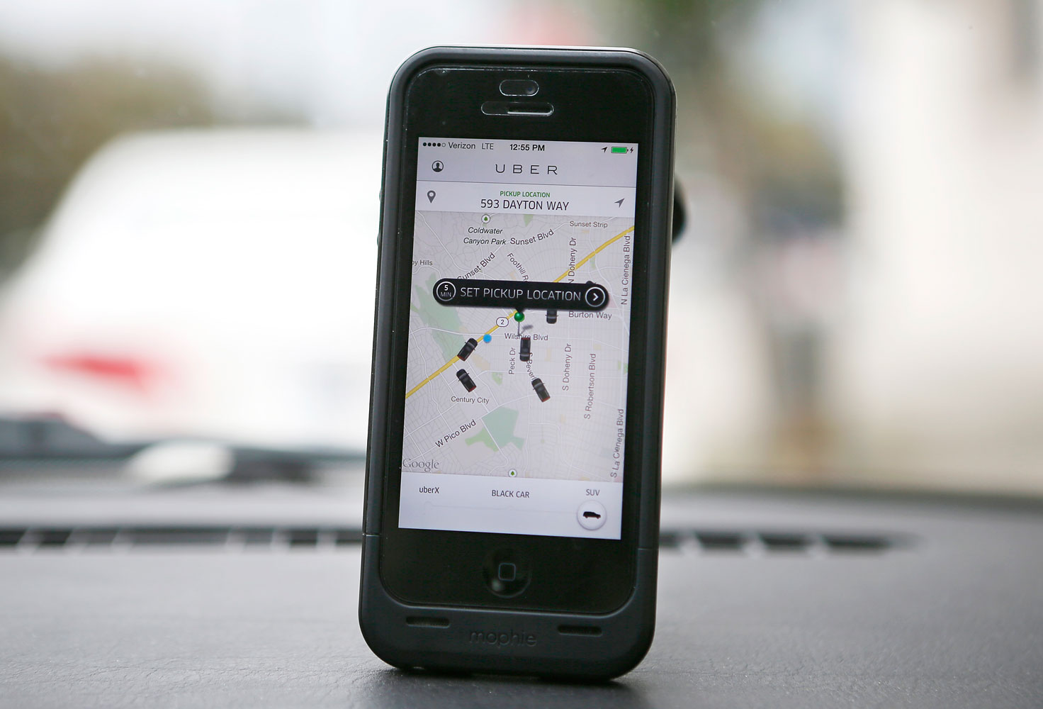 An Uber app is seen on an iPhone in Beverly Hills, Calif., on Dec. 19, 2013.
