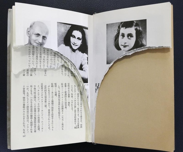 Ripped pages of Anne Frank's "Diary of a Young Girl" are pictured at a library in Tokyo
