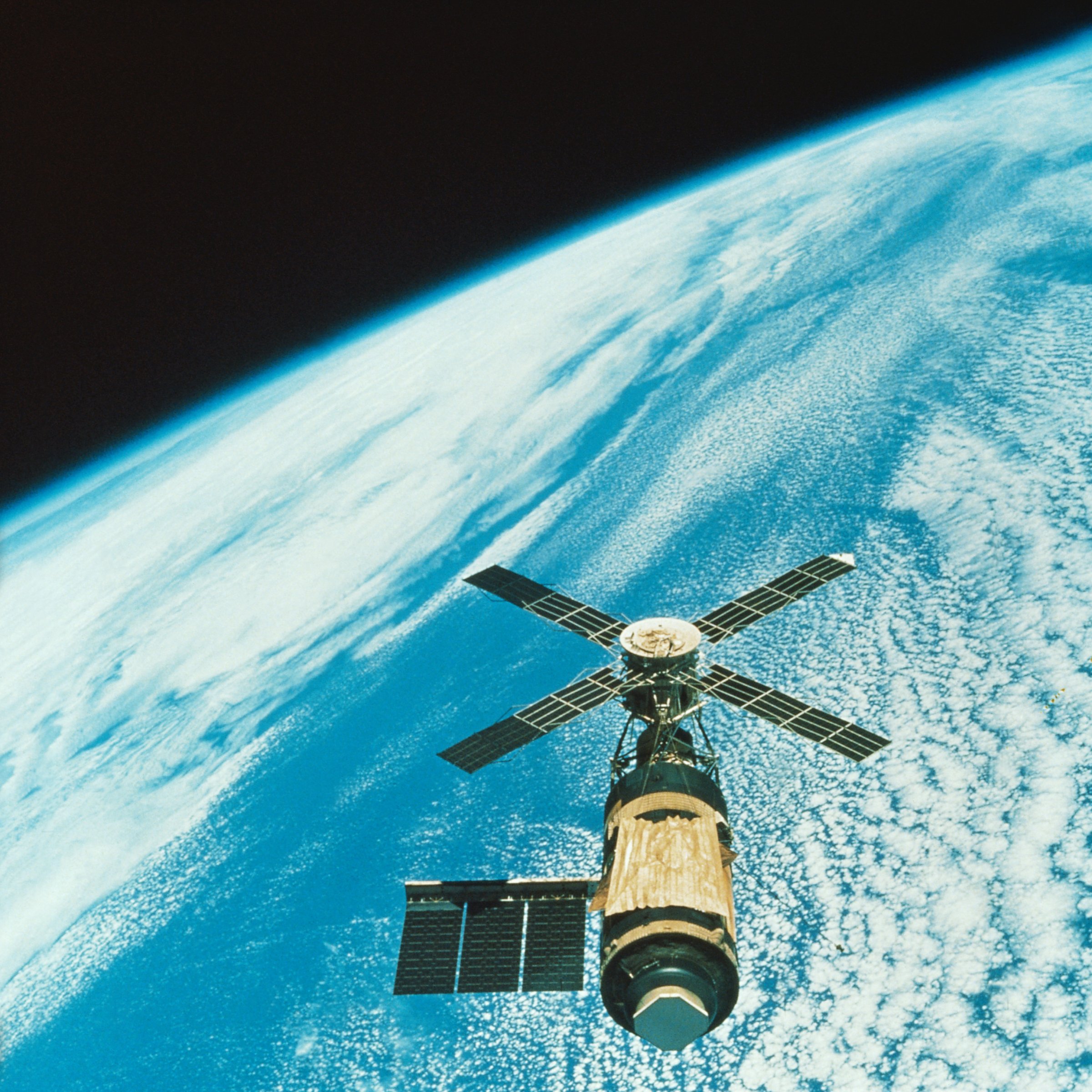 Skylab, with its gold colored sun shield covering its crew module