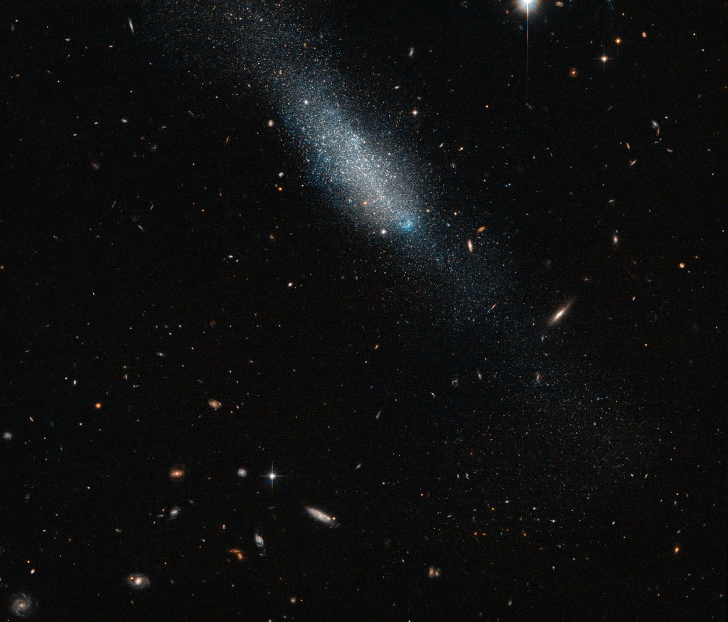 This sprinkling of cosmic glitter makes up the galaxy known as ESO 149-3, located 20 million light-years away from Earth. It is an example of an irregular galaxy, characterized by its undefined shape.