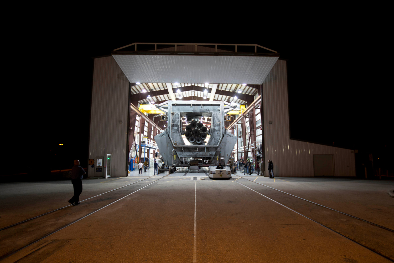 SpaceX's Falcon 9 rolls out of the hangar for SES 8 on Nov. 28, 2013.