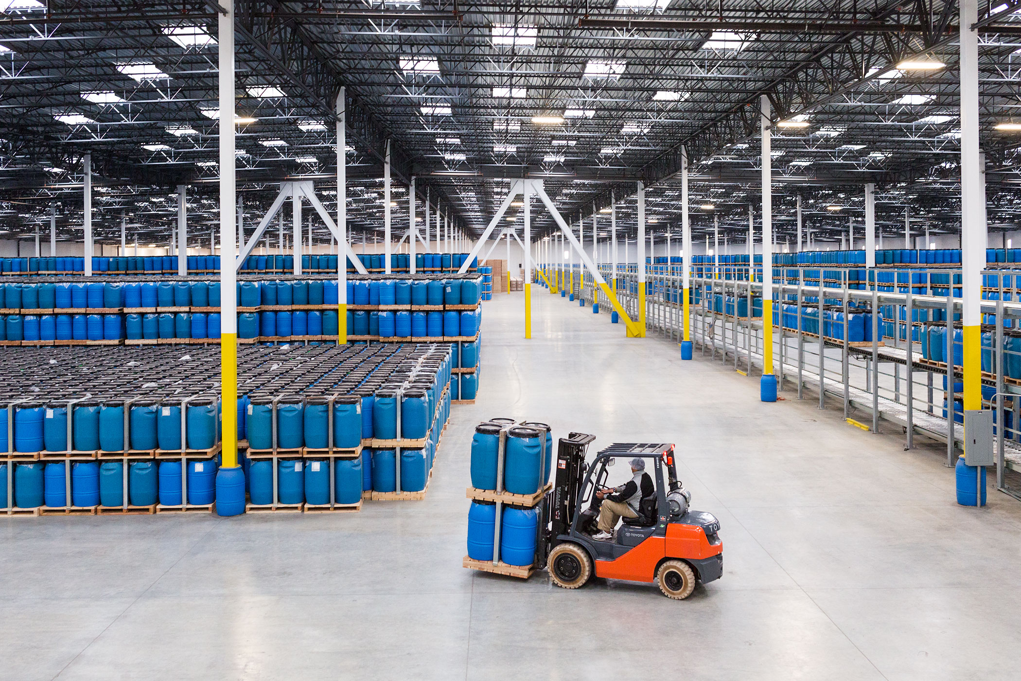 A forklift moves barrels of chili around the warehouse where they are stored until needed for processing into Sriracha, Chili Garlic and Sambal Olek—ground chilis with no added ingredients.