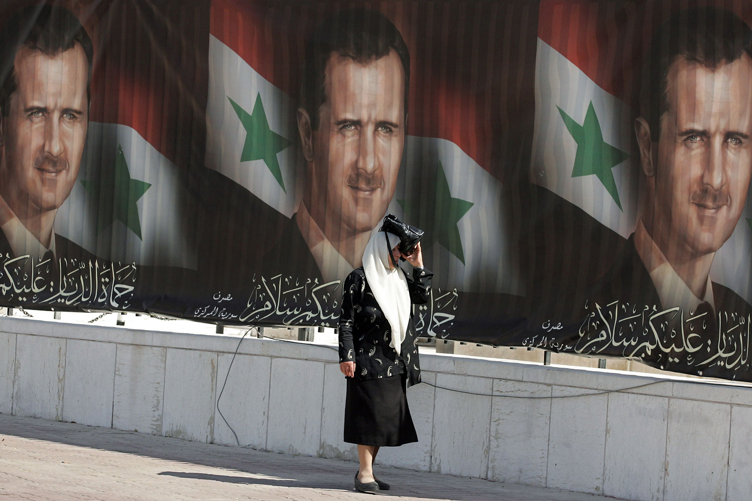 Portraits of President Bashar Assad seen in Damascus during the previous presidential poll in May 2007. (Hassan Ammar—AFP/Getty Images)