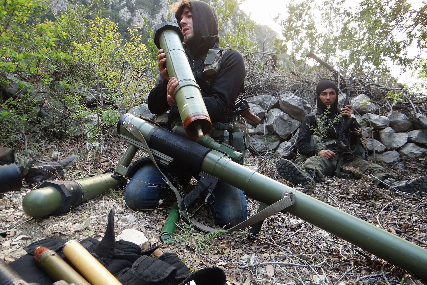 A rebel fighter checks a launcher near the village of Kessab and the border crossing with Turkey, in the northwestern province of Latakia, on March 23, 2014.  Rebels seized Kessab a day later. (Amr Radwan al-Homsi—AFP/Getty Images)