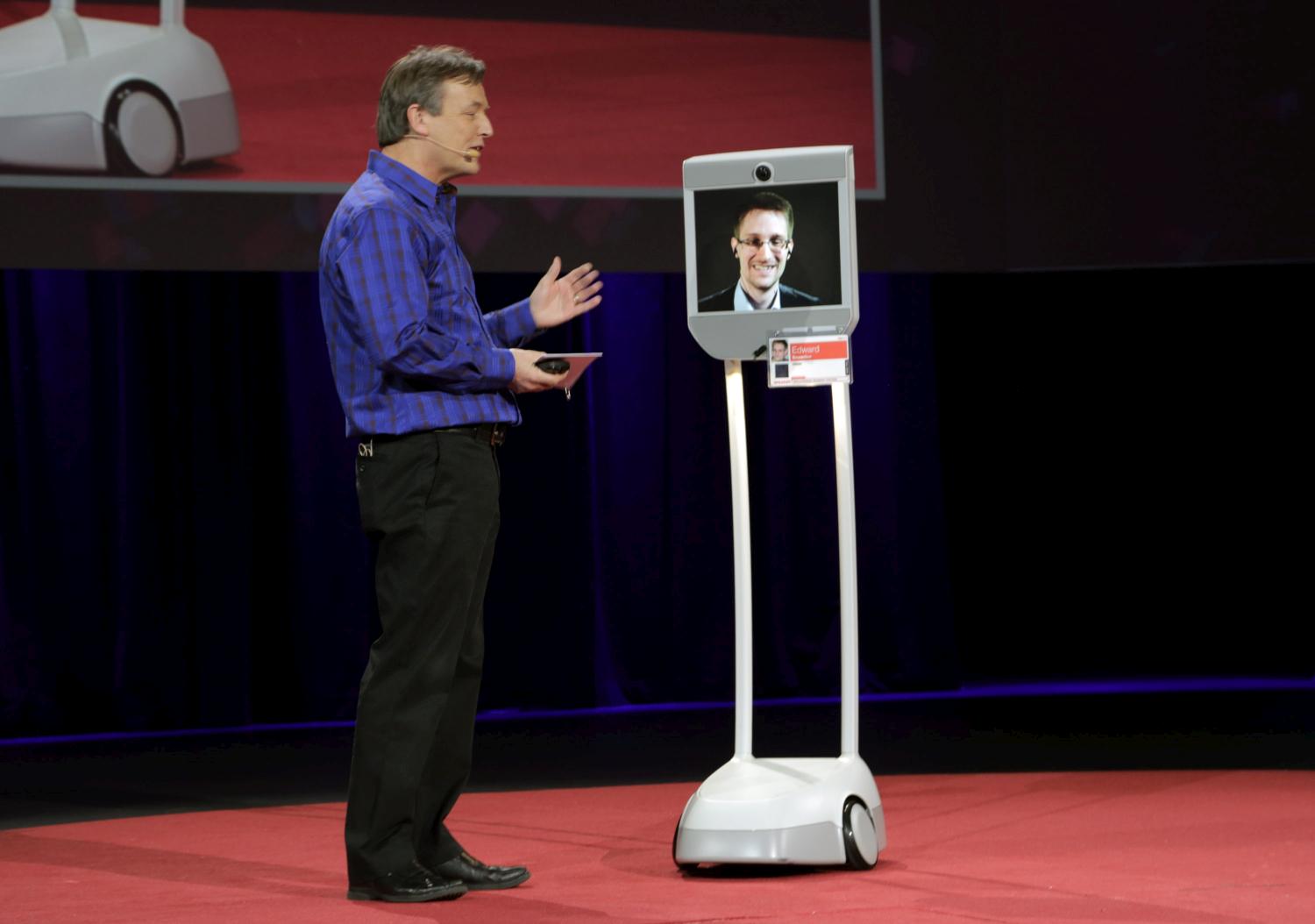 Edward Snowden is interviewed by TED Curator Chris Anderson (L) via a BEAM remote presence system during the 2014 TED conference March 18, 2014 in Vancouver, Canada. (Steven Rosenbaum / Getty Images)