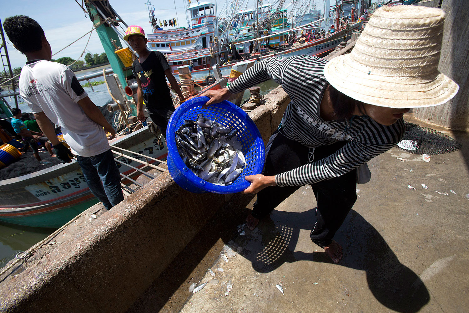 Workers from Burma land fish after a trip to the Gulf of Thailand (Sakchai Lalit / AP)
