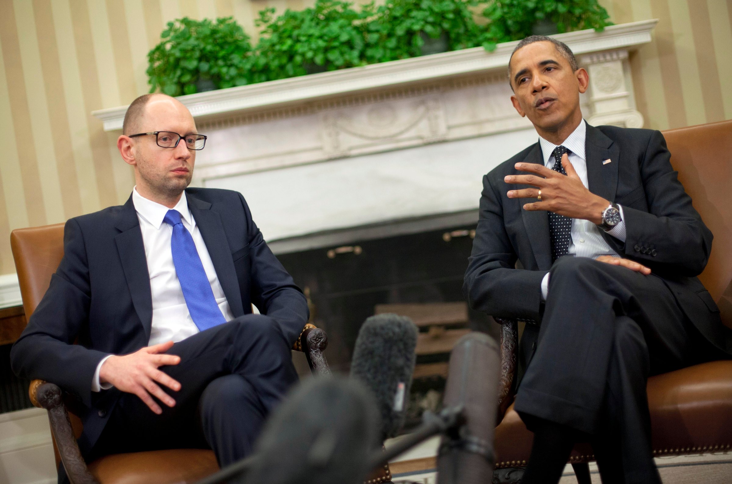 President Barack Obama, right, with Ukraine Prime Minister Arseniy Yatsenyuk, left, talk in the Oval Office of the White House in Washington