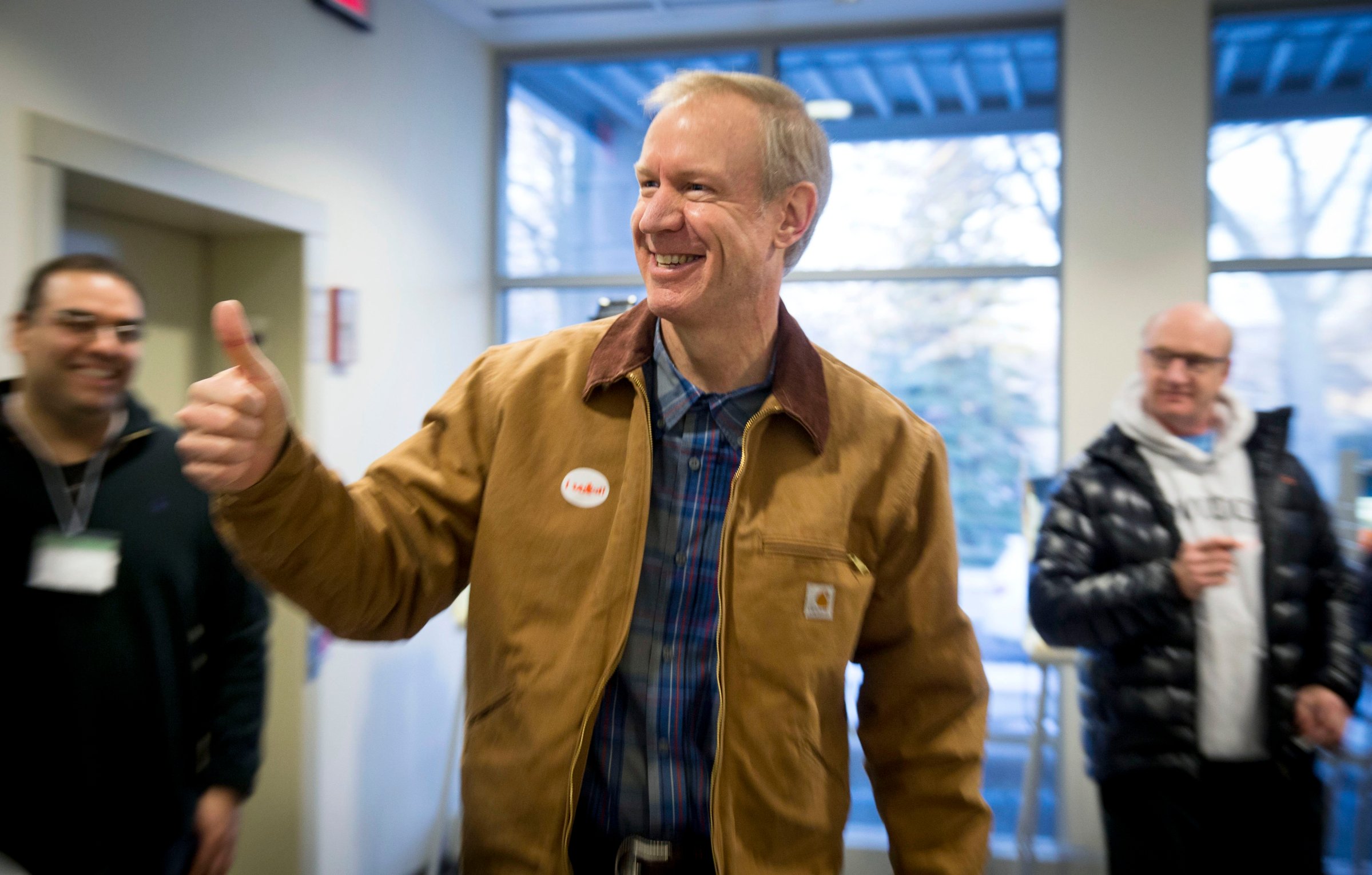 Illinois Republican gubernatorial candidate Bruce Rauner exits the polling place after voting in Winnetka, Ill.