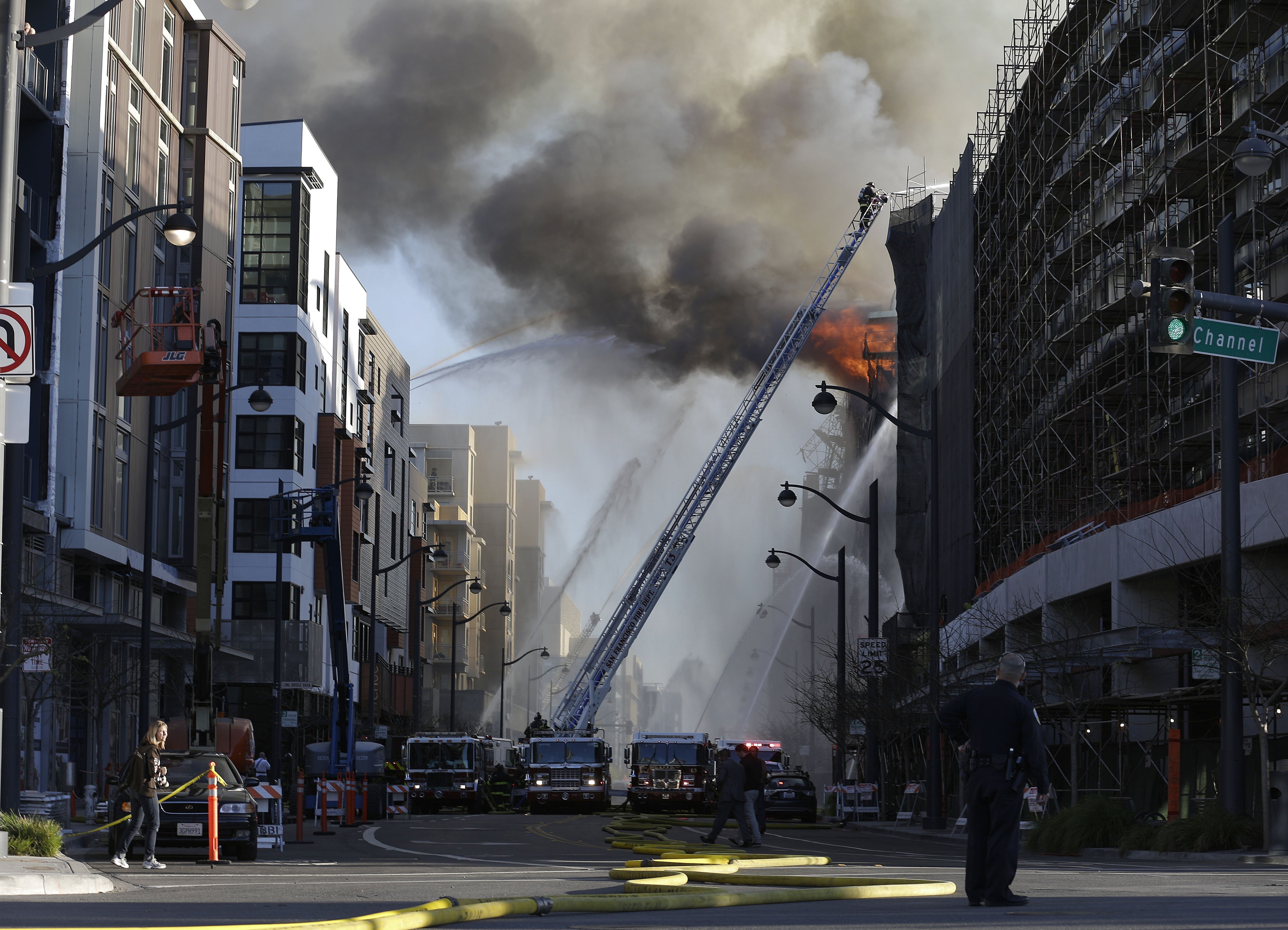 Firefighters battle a fire burning in San Francisco