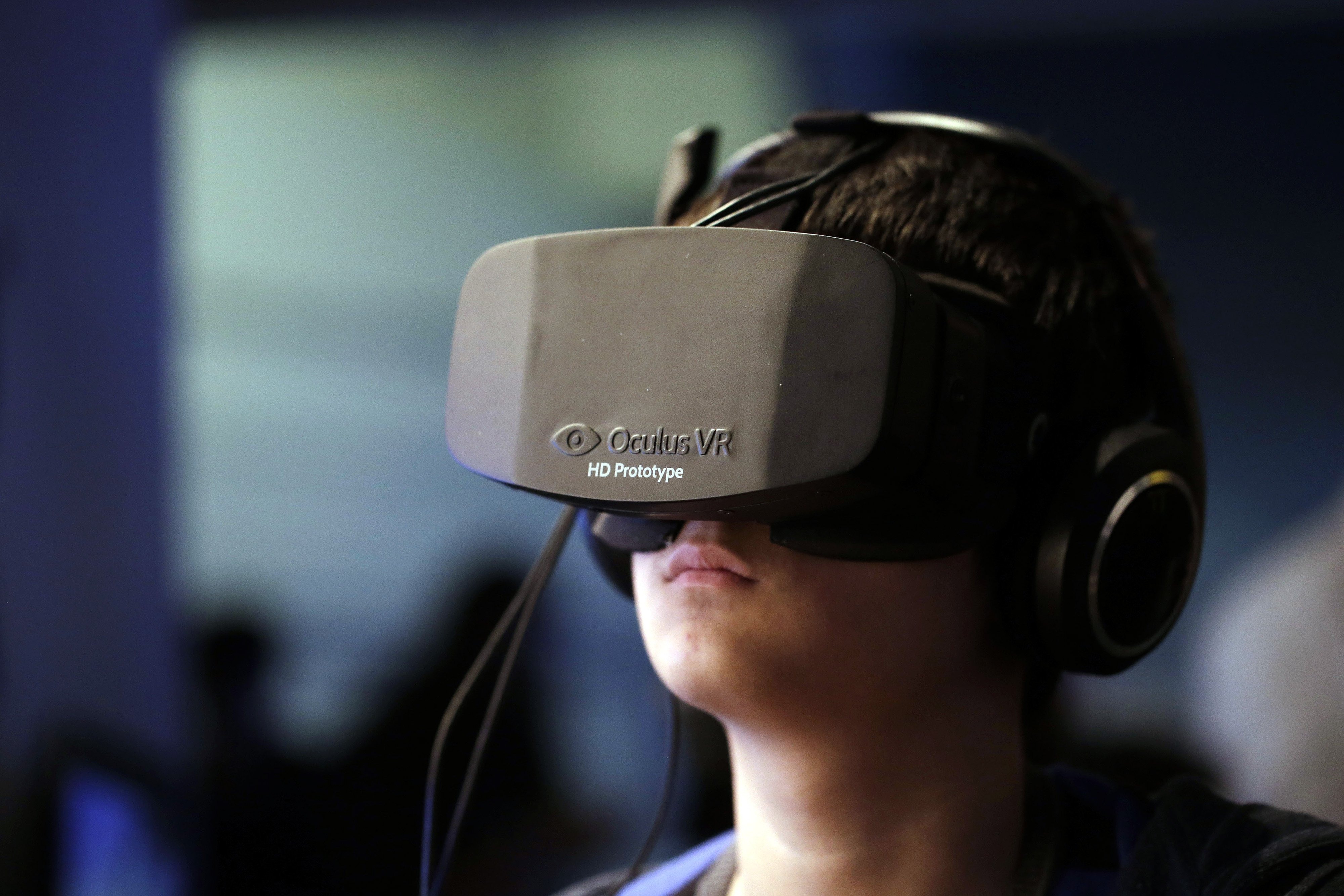 A gamer wears a high-definition virtual reality headset, manufactured by Oculus VR Inc., at the Eurogamer Expo 2013 in London, Sept. 28, 2013. (Matthew Lloyd—Bloomberg/Getty Images)