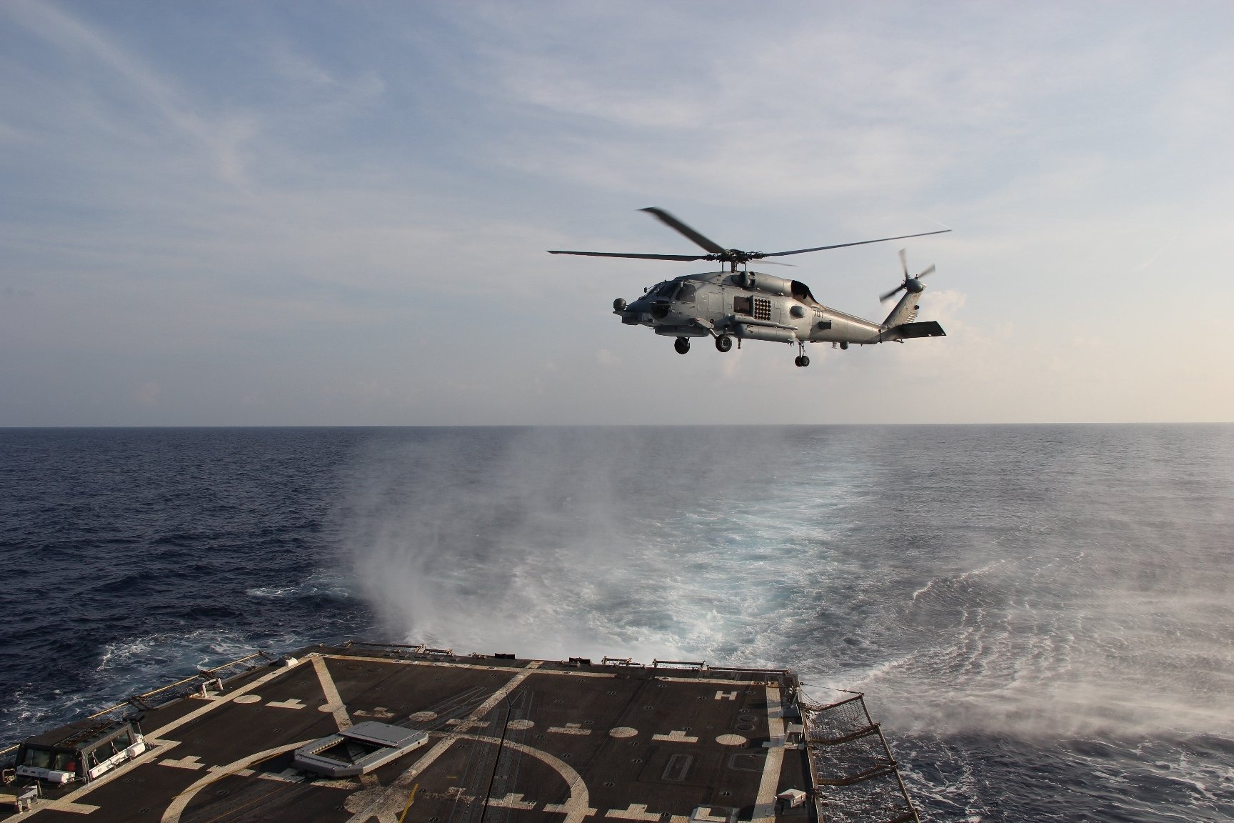 A Sea Hawk helicopter departs from USS Pinckney to search for the missing Malaysia Airlines flight on March 9, 2014.