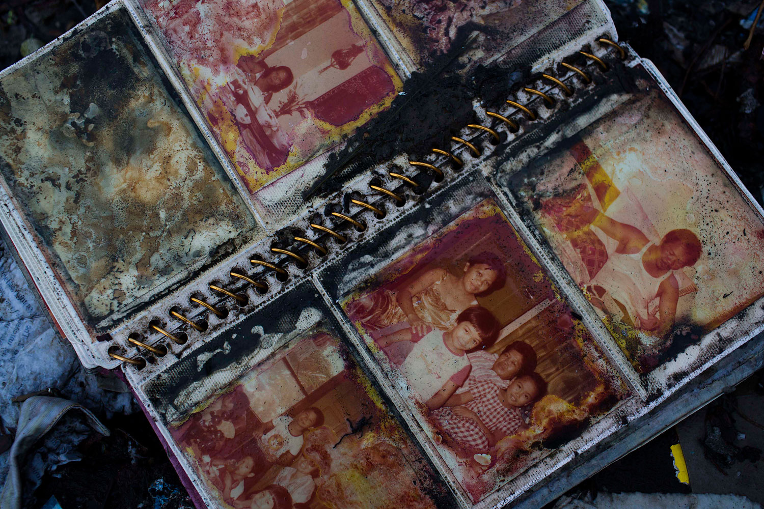 A photo album lies in the rubble in a neighborhood destroyed by Typhoon Haiyan in Tacloban, Philippines on November 22, 2013.