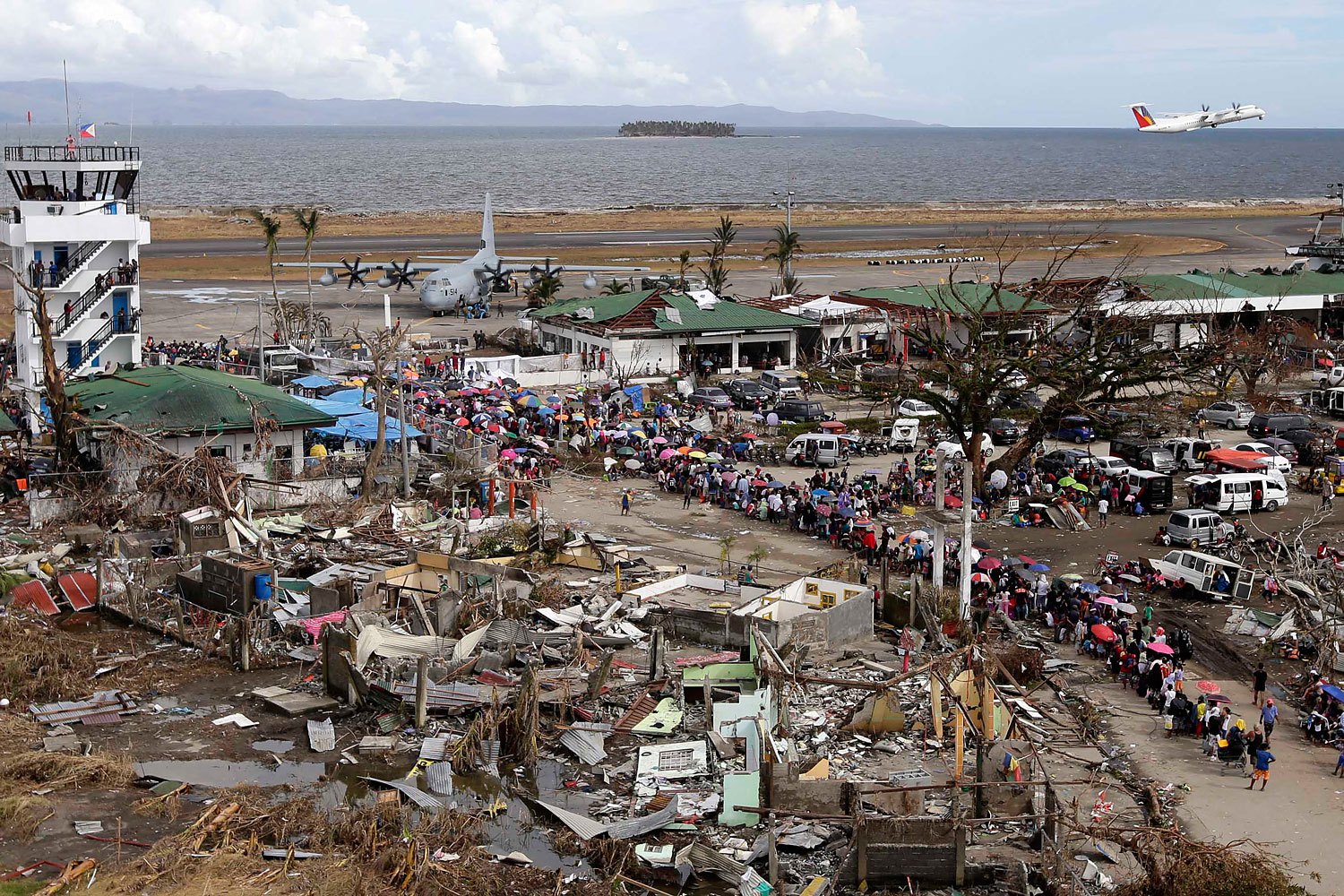 A view of Filipino typhoon survivors prior their boarding on a US C-130 plane in the super typhoon devastated city of Tacloban, Leyte province, Philippines, November 13, 2013.