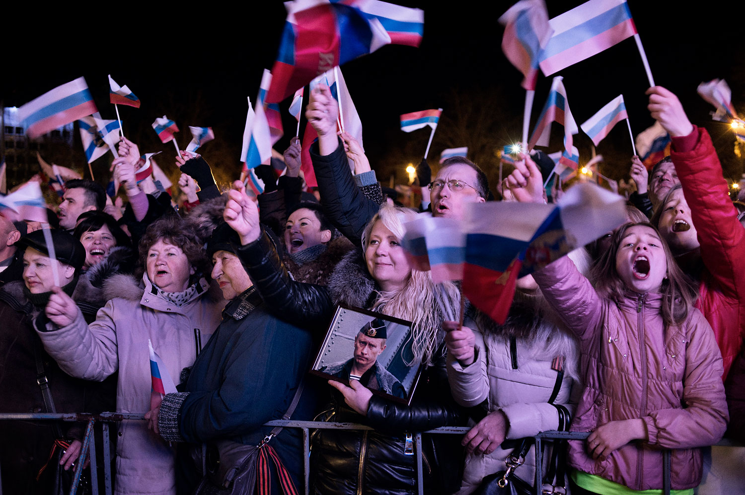 A jubilant crowd in Crimea waits for the results of the referendum in the Crimean city of Sevastopol on March 16, 2014.