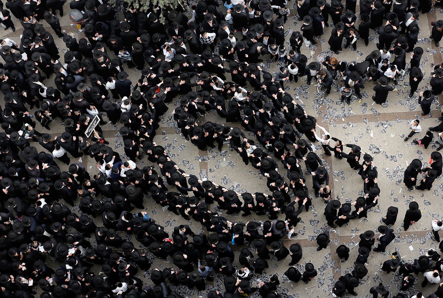 Ultra-Orthodox Jewish men dance before the start of a mass prayer in Jerusalem, March 2, 2014.