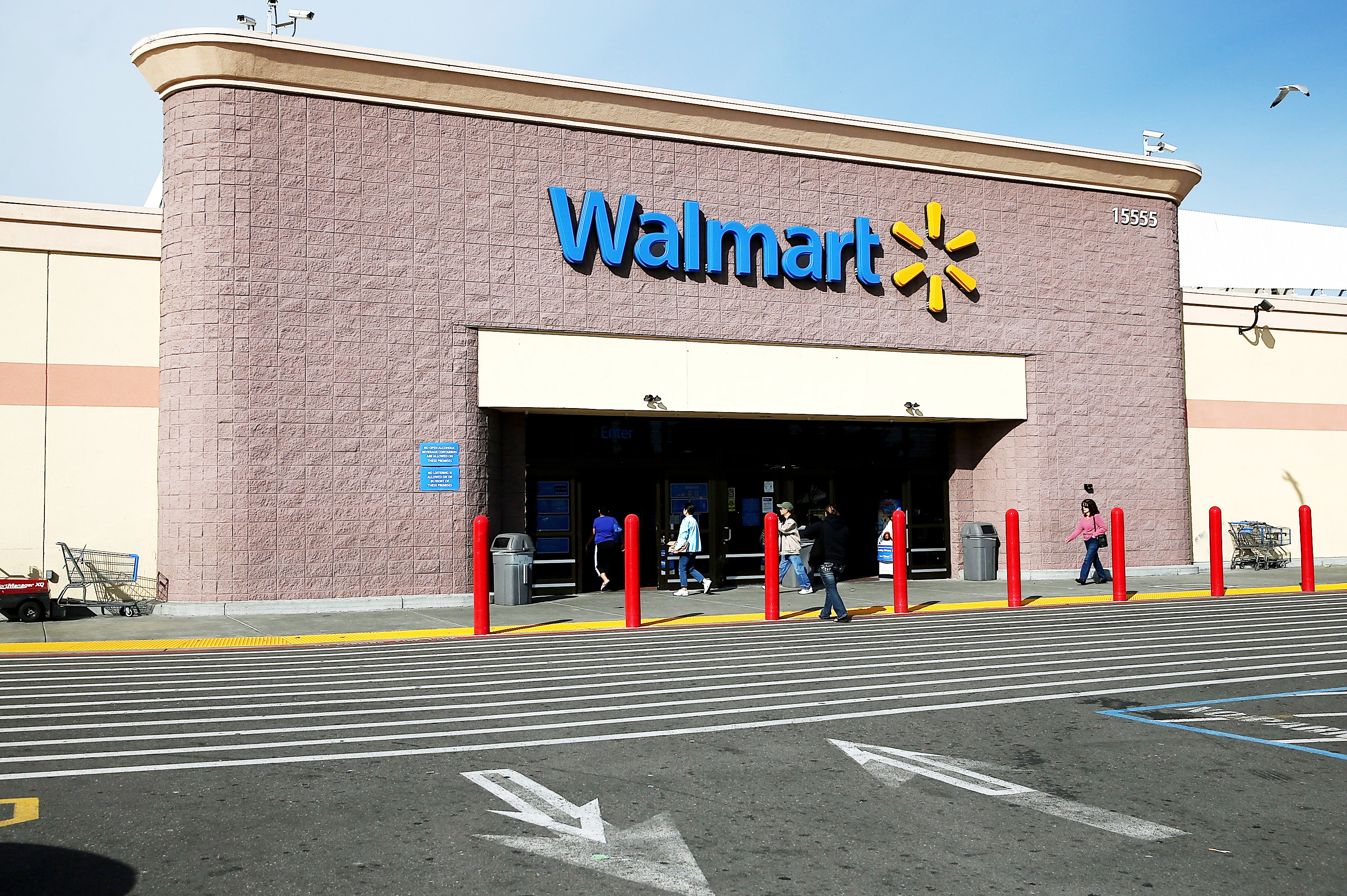 Customers enter a Wal-Mart store on Feb. 20, 2014 in San Lorenzo, Calif.