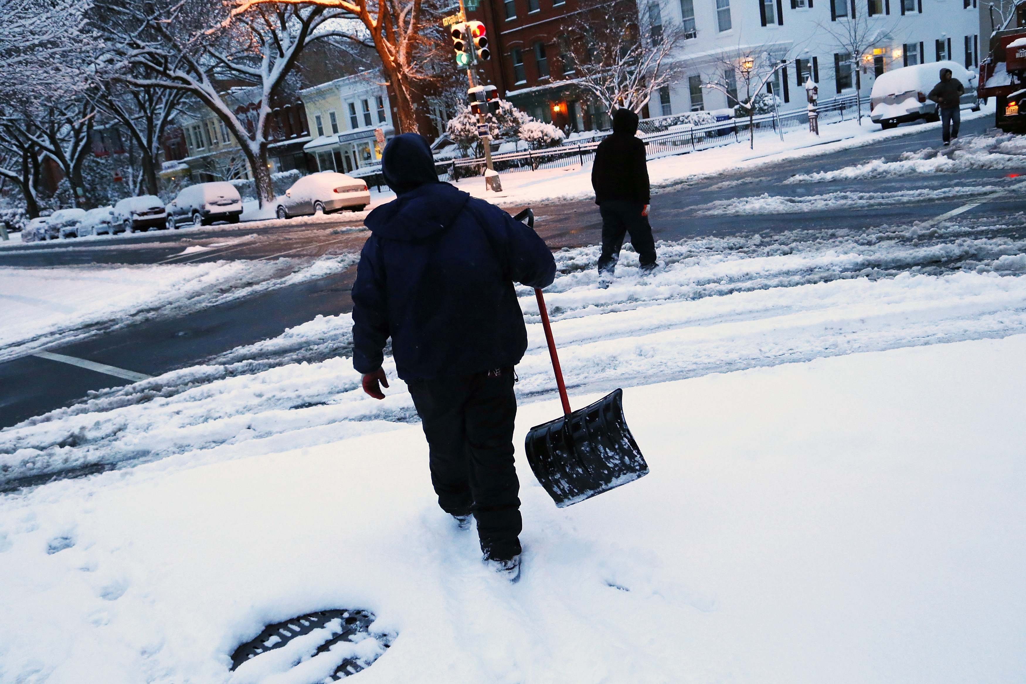 Snow shovelers in the Capitol Hill neighborhood in Washington, D.C., on March 17, 2014. (Jonathan Ernst—Reuters)
