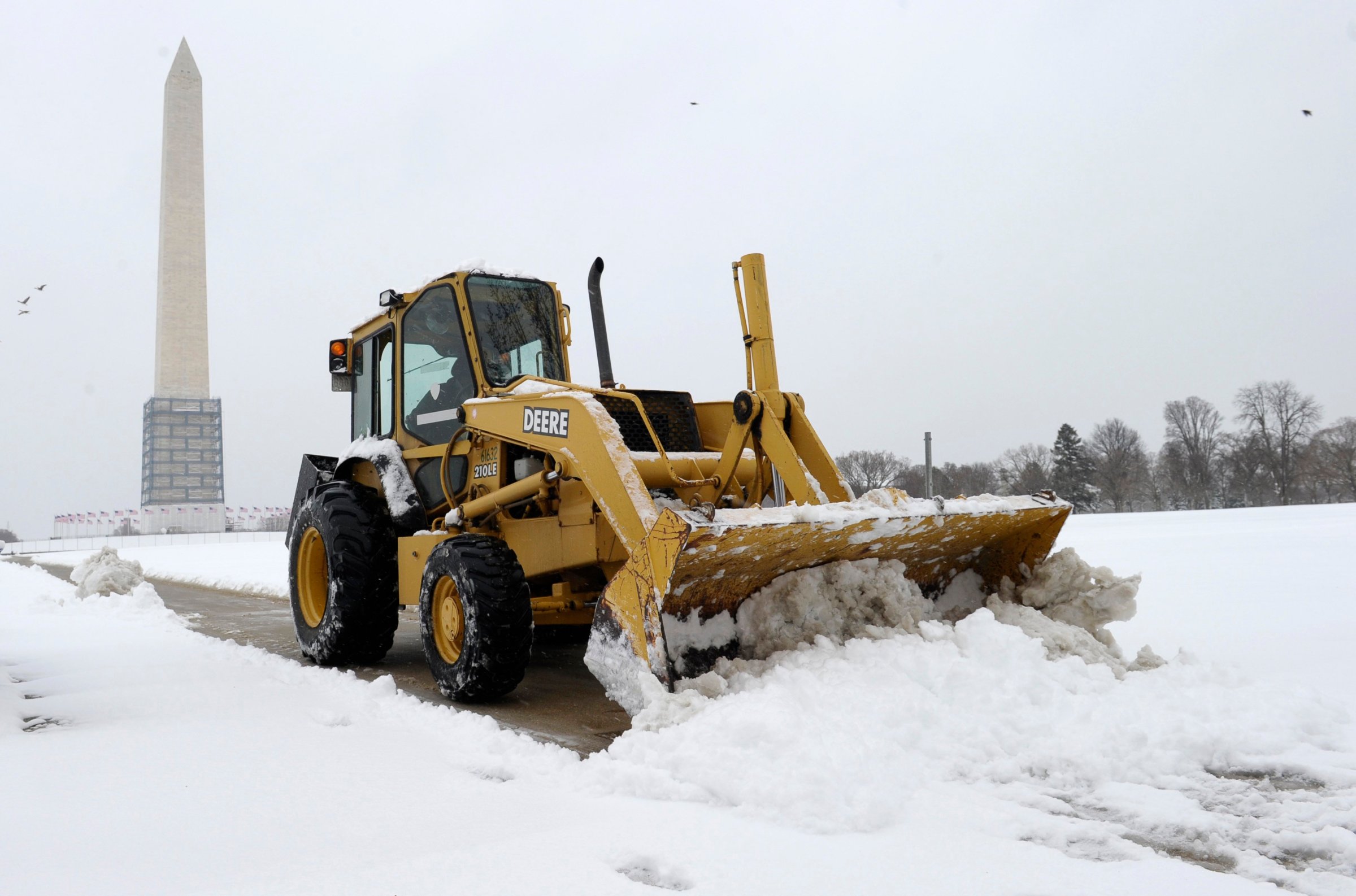A snow plow clears the area around the Washington Monument in Washington, D.C. on March 17, 2014.