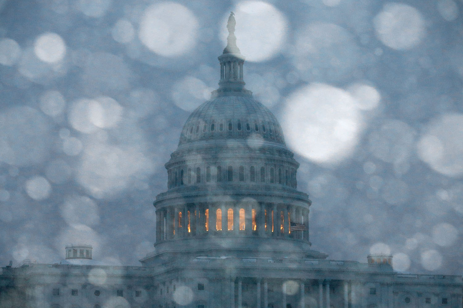 Mar. 3, 2014. Snow falls in front of the U.S. Capitol in Washington, DC. The Federal Government was closed due to major snow storm that was expected to dump up to a foot of snow in the Washington area.