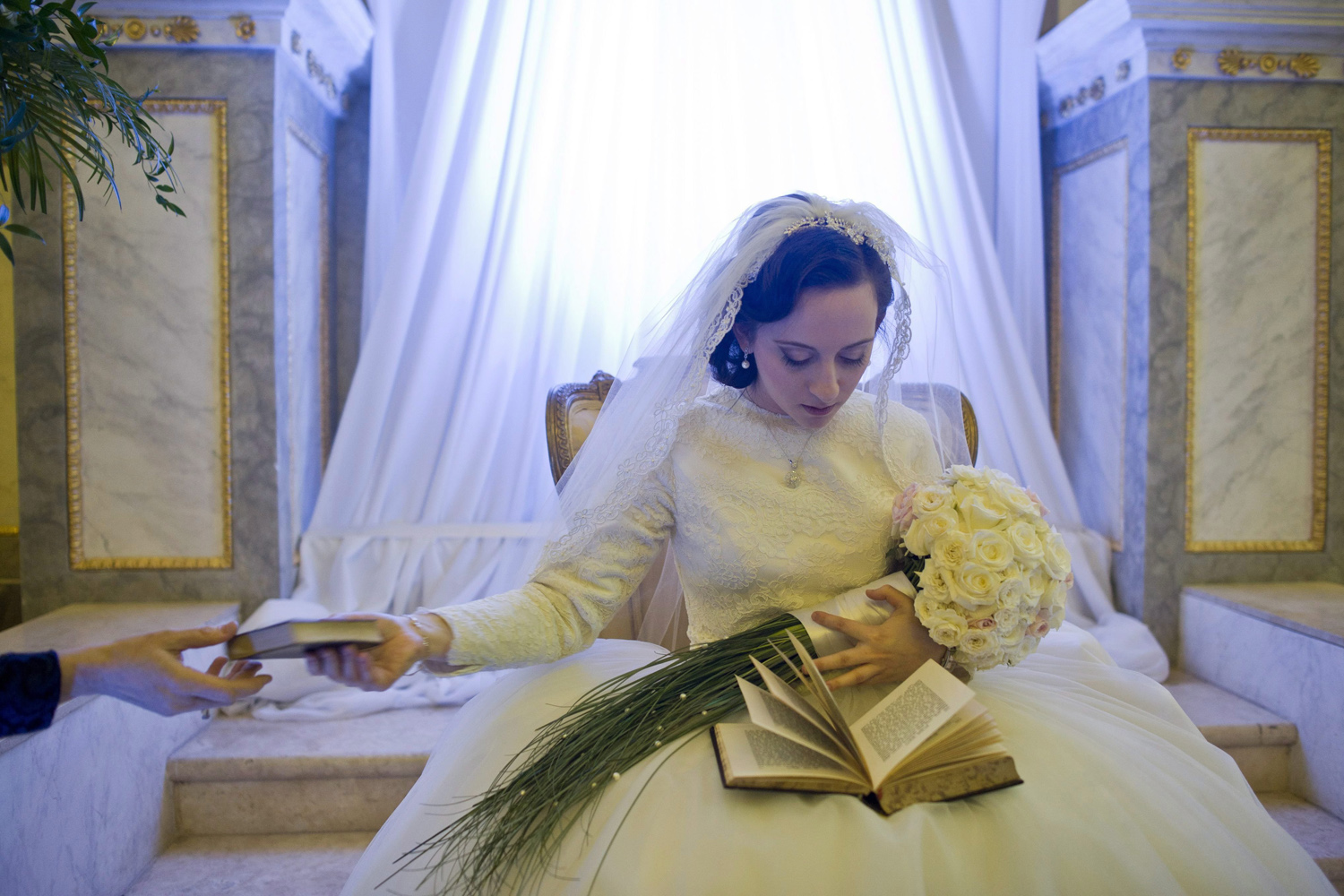 Mar. 5, 2014. Mussie Oberlander, daughter of Hungarian Chief Rabbi Baruch Oberlander, secretary general of Rabbinical Center of Europe (RCE) and establisher of the Hungarian Chabad-Lubavitch trend,  prays during her traditional Jewish wedding in the Obuda Synagogue in Budapest, Hungary.