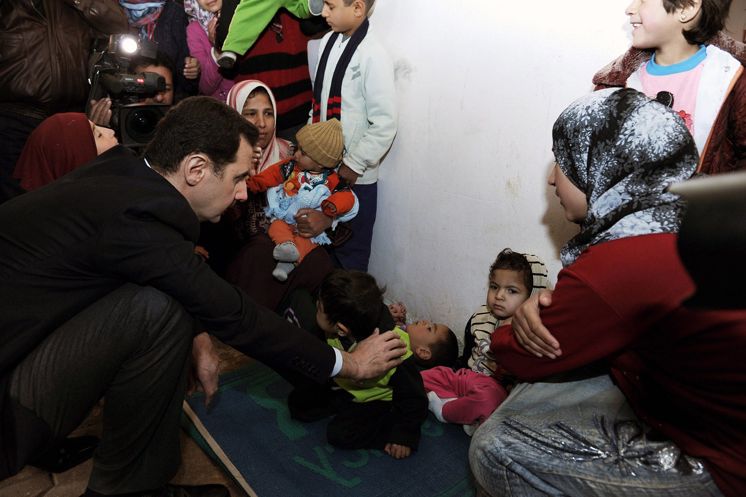 Syrian President Assad visits displaced Syrians