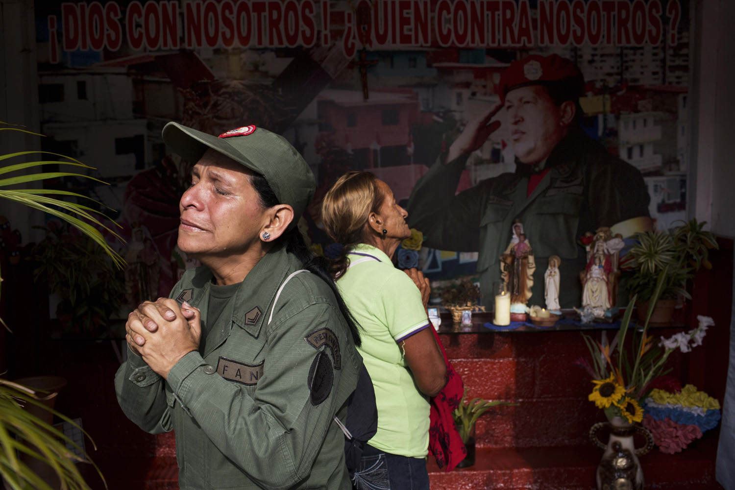 Mar. 5, 2013. Marisol Perez, Venezuelan Army specialist, cries while visiting a chapel to mark the death of Venezuela's late President Hugo Chavez, in Caracas, Venezuela.