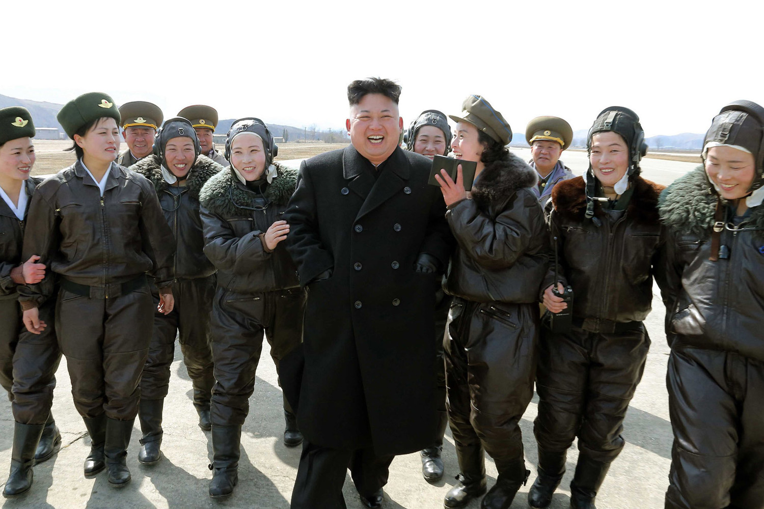 Mar. 7, 2014. North Korean leader Kim Jong-Un is surrounded by female pilots as he inspects the Korean People's Army (KPA) Air and Anti-Air Force Unit 2620.