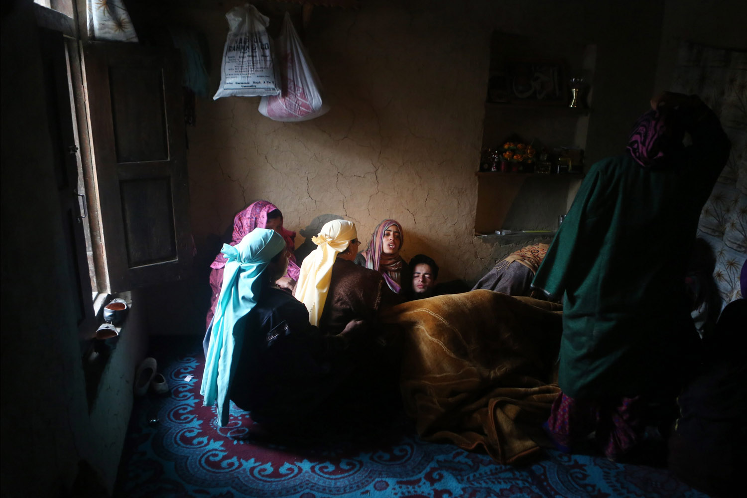 Apr. 18, 2014. Relatives mourn during the funeral of Indian Kashmir's main opposition Peoples Democratic Party rural body head (Sarpanch) Mohammad Amin Pandith, in Gulzarpora village in south Kashmir's Awantipora district.