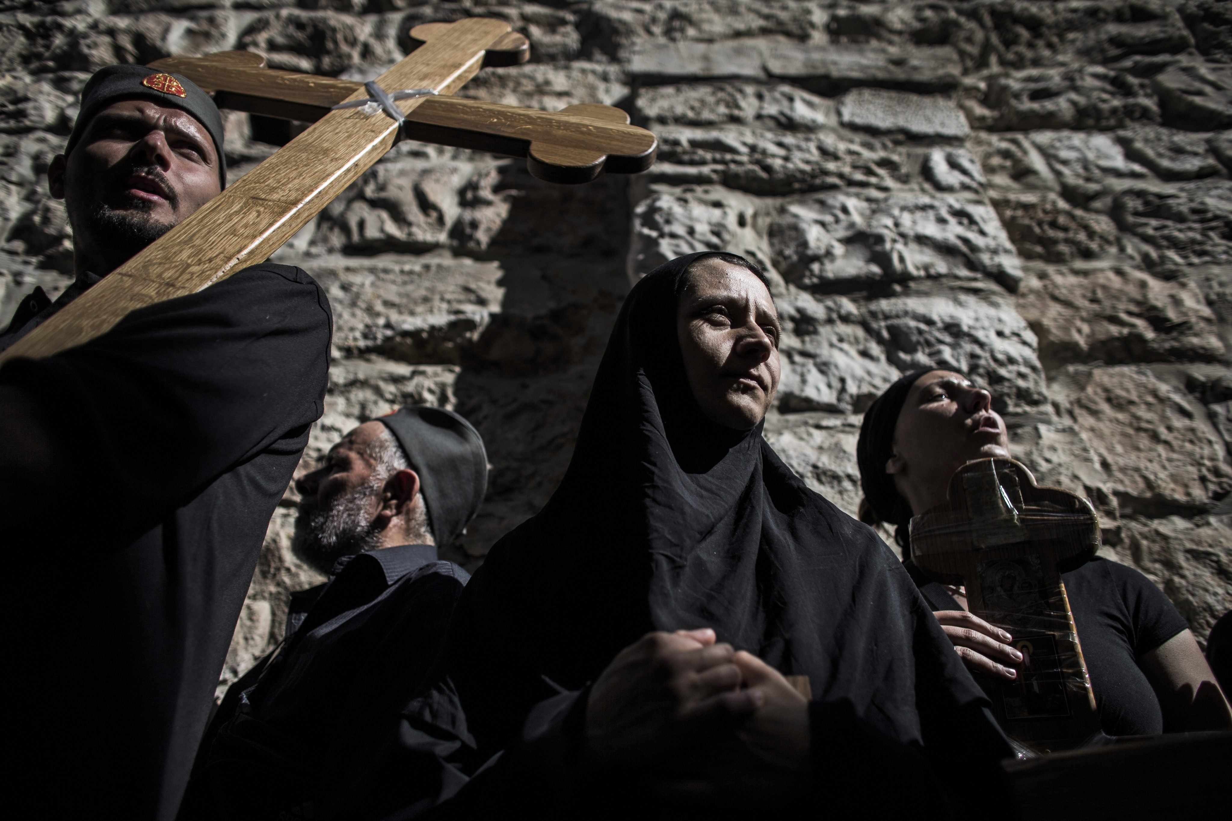 Apr. 18, 2014. Christian worshipers carry crosses during a Good Friday procession on the Via Dolorosa, retracing the route Jesus Christ walked to his crucifixion in Jerusalem. Thousands of pilgrims, tourists and clergy took part in the celebrations.