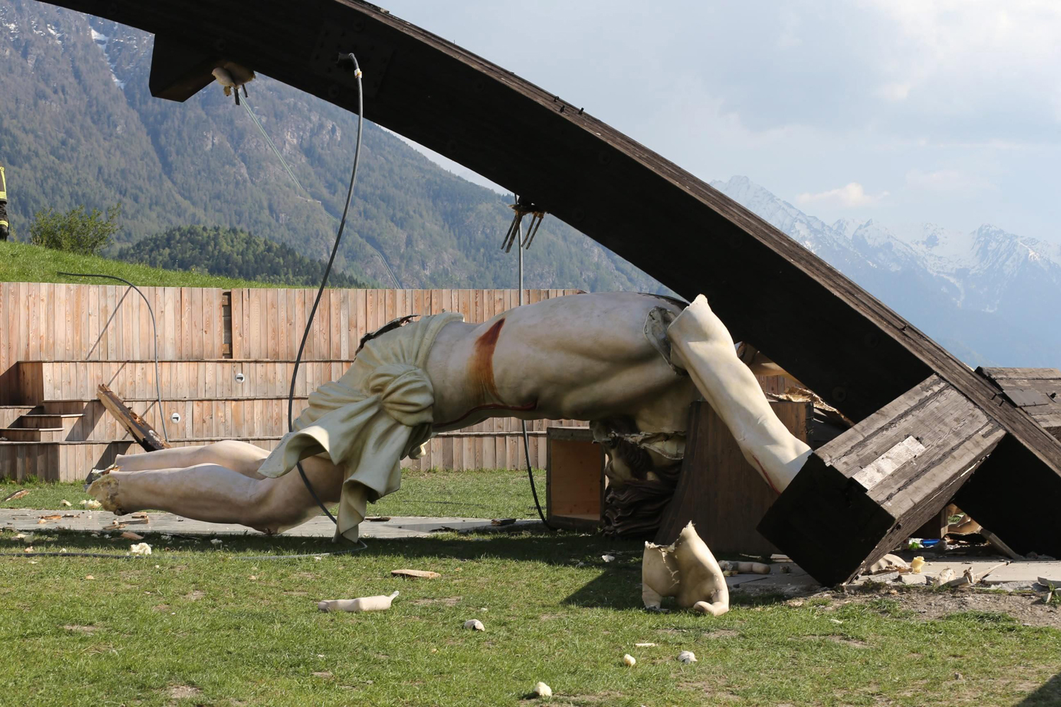 Apr. 24, 2014. A general view of the broken statue after the 30-metre-high, curved wooden cross dedicated to the late John Paul II collapsed in Cevo, Valcamonica, Italy, killing a 21-year-old man.